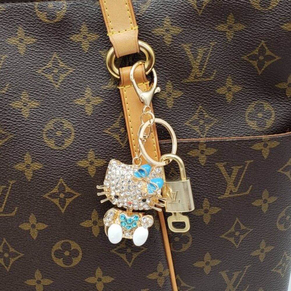 Louis Vuitton Gold Lock 🔒 Authentic LV Key + Unbranded Hello Kitty Bag Charm - Picture 2 of 7